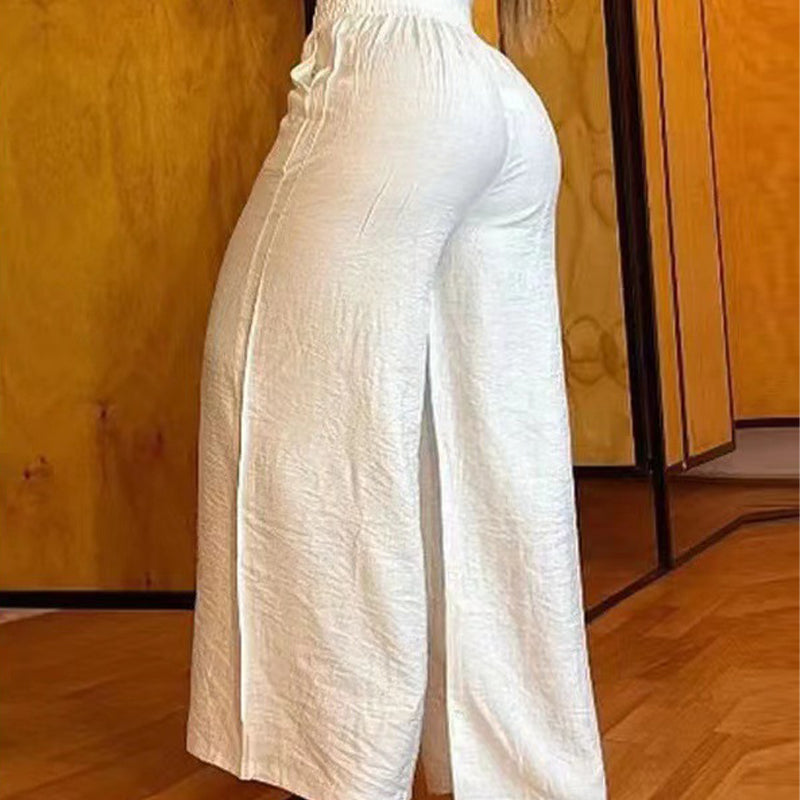 Dambyxor med hög midja, vida ben och bältesdetalj