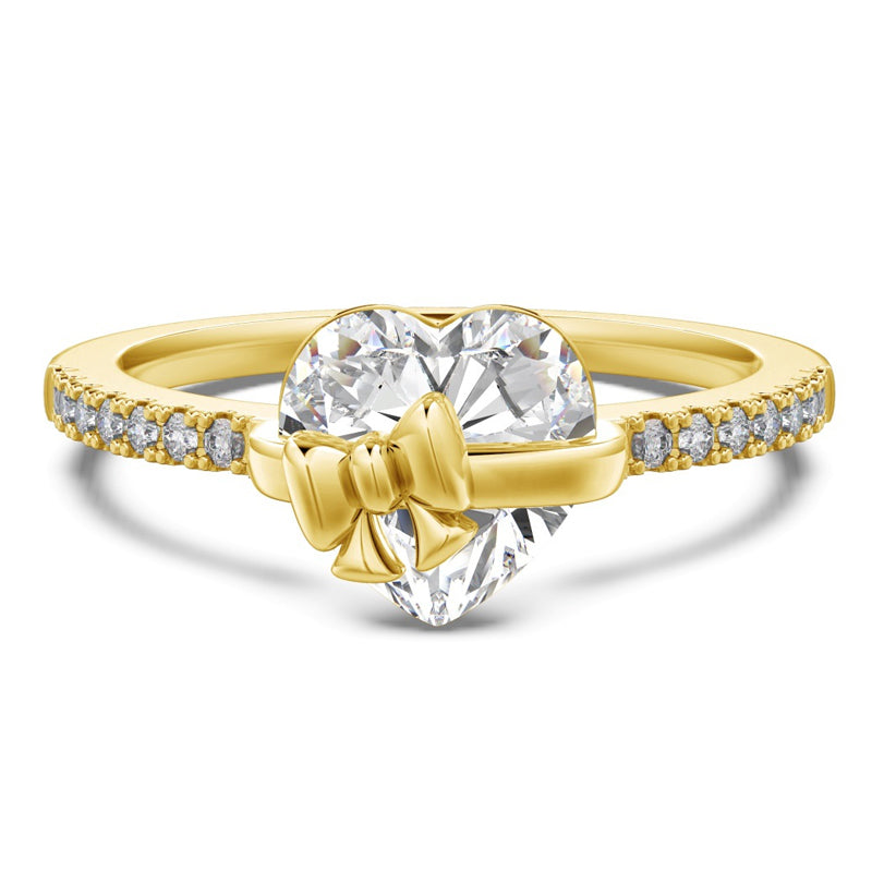 Elegant silverring med hjärtdetalj och rosett