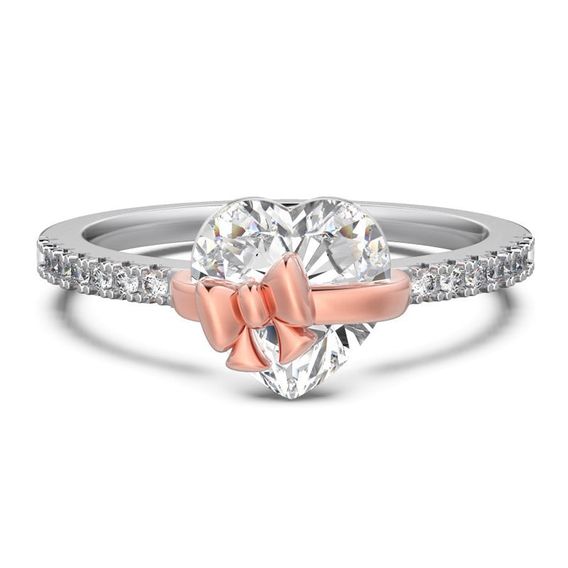 Elegant silverring med hjärtdetalj och rosett