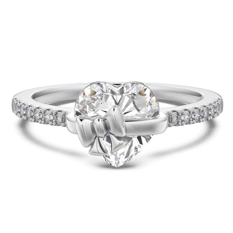 Elegant silverring med hjärtdetalj och rosett